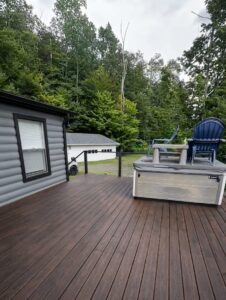 Before and after deck painting New York project showing a professionally refreshed outdoor deck